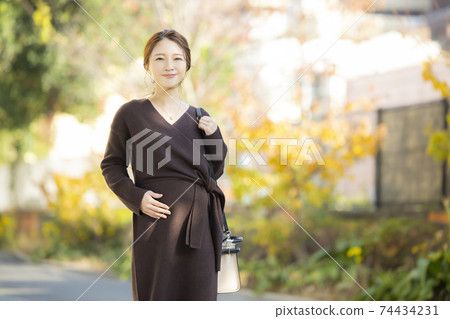 Pregnant woman outdoors 74434231