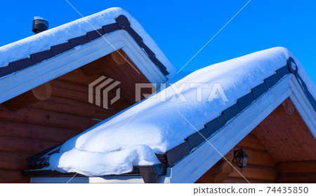 Snow drift on roof after of snowfalls. 74435850