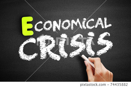 Hand writing Economical crisis on blackboard, concept background Hand writing Economical crisis on blackboard, concept background 74435882