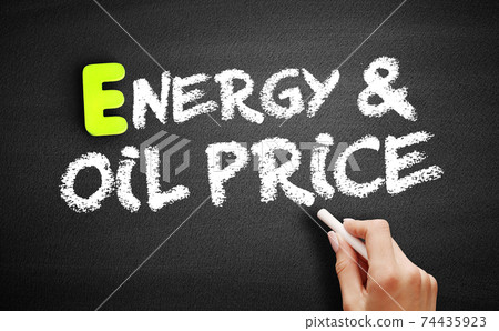Hand writing Energy & Oil Prices on blackboard, concept background 74435923