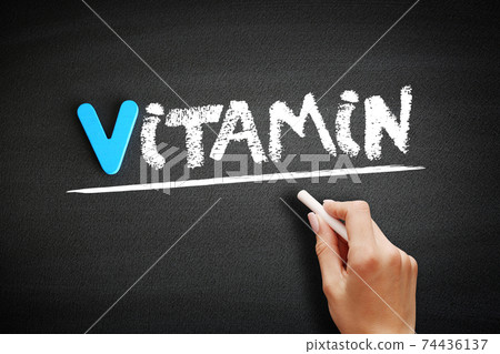 Vitamin text on blackboard, health concept background 74436137