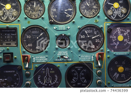 Aircraft instruments on a dashboard of an old made in USSR plane, close up 74436399
