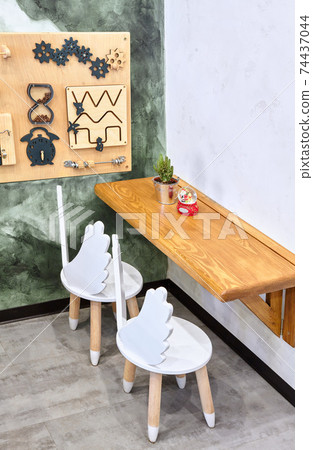 Stylish. Kid corner.With chair for children.Modern interior of cafe. 74437044