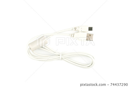 Top view of a white data cable with a ferrite filter and USB connectors. Top view of a white data cable with a ferrite filter and USB connectors. 74437290