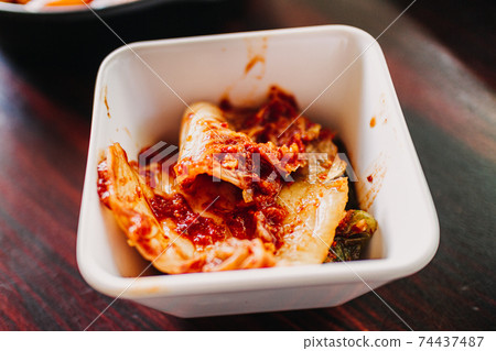 Homemade Cabbage Kimchi served in a little cup. Homemade Cabbage Kimchi served in a little cup. 74437487