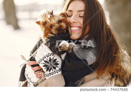 young woman hugging her dog close up outdoors young woman hugging her dog close up outdoors 74437686