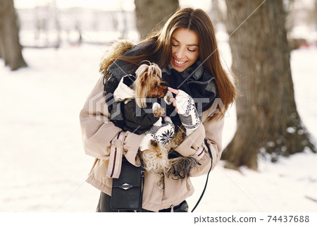 young woman hugging her dog close up outdoors young woman hugging her dog close up outdoors 74437688