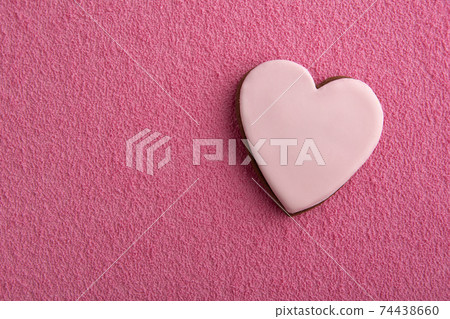 Cookies in shape of hearts with sugar icing on pink background. Space for text Cookies in shape of hearts with sugar icing on pink background. Space for text 74438660