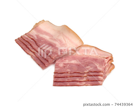 Boiled-smoked pork brisket cut into slices on white background. Bacon. Boiled-smoked pork brisket cut into slices on white background. Bacon. 74439364