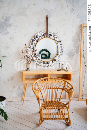 Loft interior. braided chair at the make-up table with a mirror Loft interior. braided chair at the make-up table with a mirror 74439808