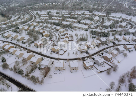 The winter aerial view of small town residential courtyards houses covered snow The winter aerial view of small town residential courtyards houses covered snow 74440371