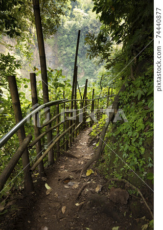Trail towards the waterfall at Tumpak Sewu, East Java, Indonesia. Trail towards the waterfall at Tumpak Sewu, East Java, Indonesia. 74440877