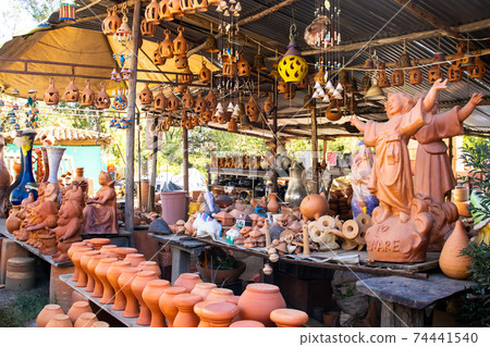 RAQUIRA, COLOMBIA - FEBRUARY 2021. Traditional ceramics factory in the city of Raquira. City of Pots RAQUIRA, COLOMBIA - FEBRUARY 2021. Traditional ceramics factory in the city of Raquira. City of Pots 74441540