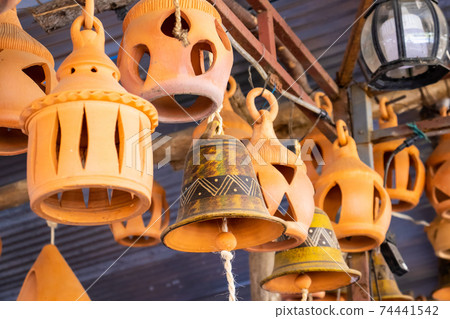 Ceramic lamps and bells at a traditional ceramics factory in the city of Raquira. City of Pots Ceramic lamps and bells at a traditional ceramics factory in the city of Raquira. City of Pots 74441542