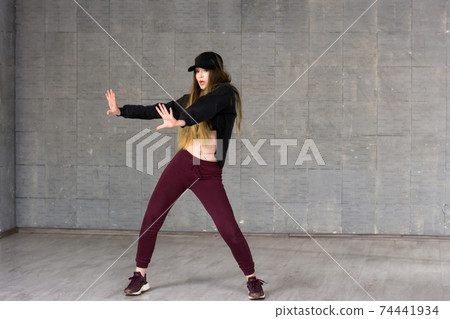 Pretty girl dancing modern dance. Pretty girl dancing modern dance. 74441934