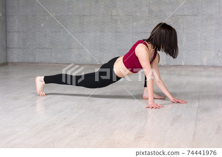 Young woman practicing yoga. 74441976