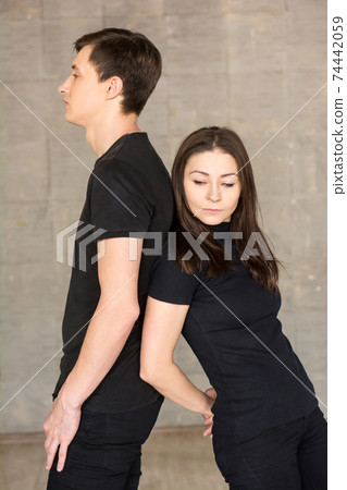 Couple of dancers standing side by side. 74442059