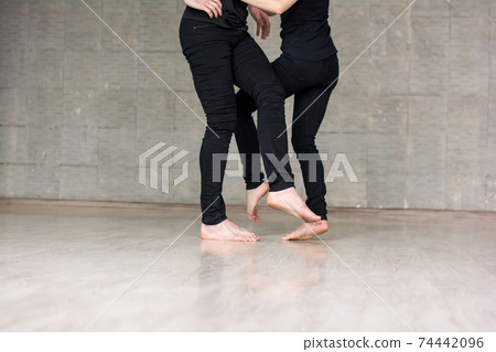 Young couple practicing new dance. 74442096
