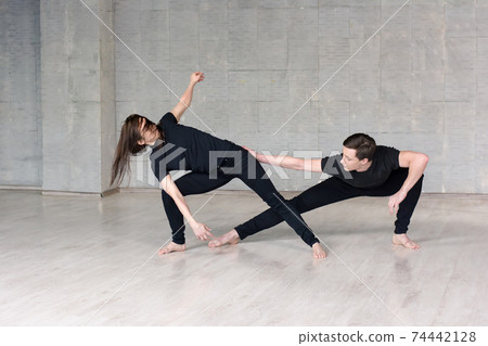 Young couple practising dance skills. Young couple practising dance skills. 74442128