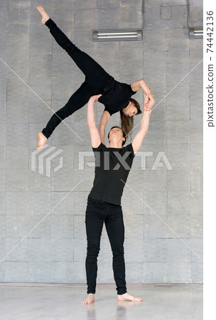 Talented couple practising modern dance. 74442136