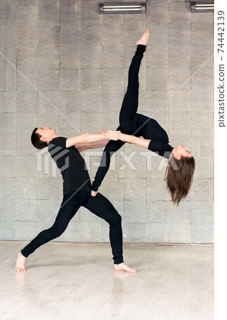 Young couple of dancers in modern dance. Young couple of dancers in modern dance. 74442139