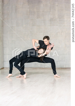 Couple of dancers in sensual movement. 74442145