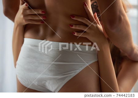 Male body, female hands. 74442183