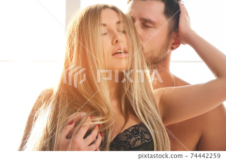 Attractive young woman and man. 74442259