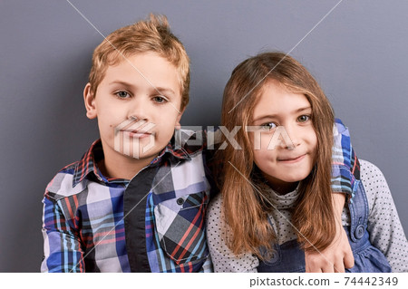 Portrait of hugging kids. 74442349