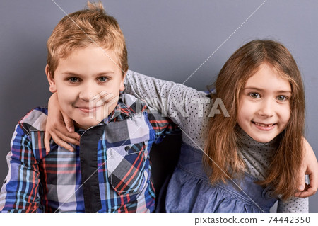 Young european brother and sister. 74442350