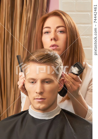 Caucasian guy at the barber. 74442461