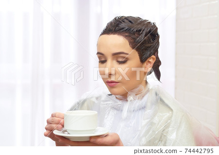 Woman in beauty salon, coffee. 74442795