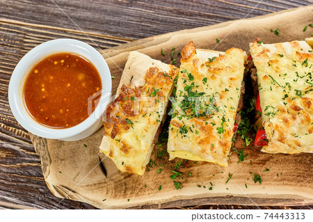 Served burito and red sauce. Served burito and red sauce. 74443313