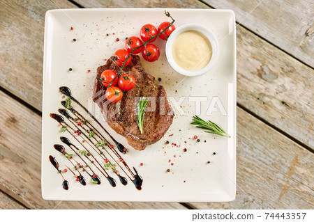 Delicious dinner on rectangle plate. Delicious dinner on rectangle plate. 74443357