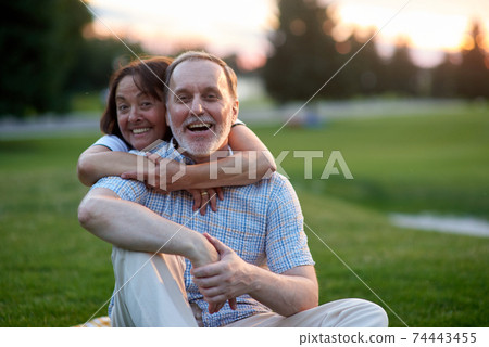Portrait of happy married couple outdoors. 74443455