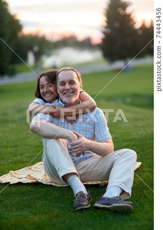 Happy mature lady hugging his husband from behind. 74443456