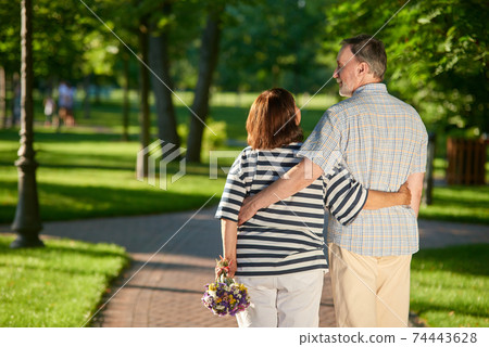 Back view mature couple in the park. 74443628
