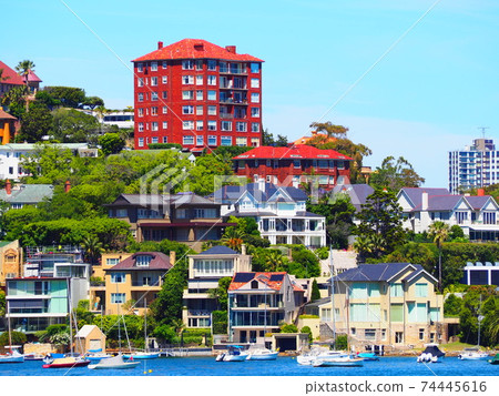 Looking into a high-class residential area from the sea 74445616