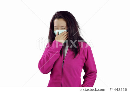 Woman wearing a flu mask 74448336