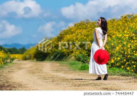 Beautiful woman in nature flower. Beautiful woman in nature flower. 74448447