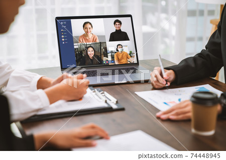 Business people using laptop on table with making video call meeting to team online. 74448945