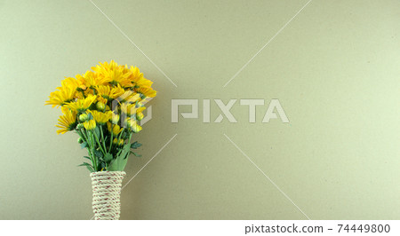 Minimal style, flat lay of bouquet yellow Chrysanthemum flowers, binding with rope on grey background. Genus is in the family Asteraceae. Any celebrations, flat lay with floral concept. Copy space. Minimal style, flat lay of bouquet yellow Chrysanthemum flowers, binding with rope on grey background. Genus is in the family Asteraceae. Any celebrations, flat lay with floral concept. Copy space. 74449800