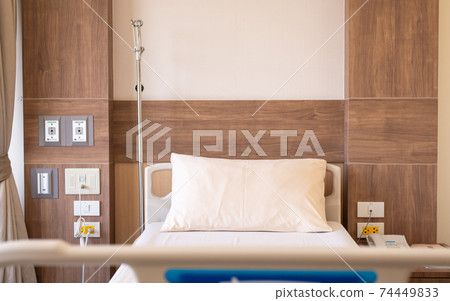 Empty sick bed for supporting patients at hospital room Empty sick bed for supporting patients at hospital room 74449833