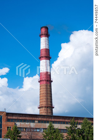 old power station chimney with deep blue sky background old power station chimney with deep blue sky background 74449857