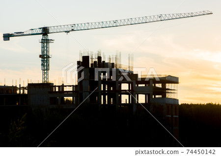 building construction site and crane silhouette 74450142