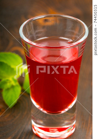 homemade raspberry wine on table homemade raspberry wine on table 74450315