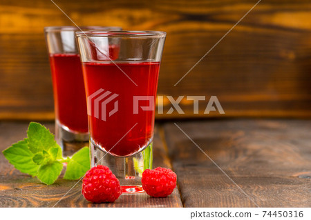 homemade raspberry liqueur with mint homemade raspberry liqueur with mint 74450316