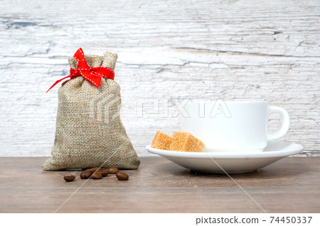 good morning concept, coffee cup with gift bag on wooden table 74450337
