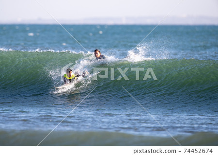 Parents and children surfing in Shonan 74452674