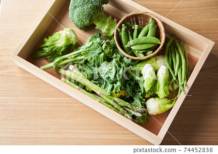 Green vegetables in a wooden box 74452838